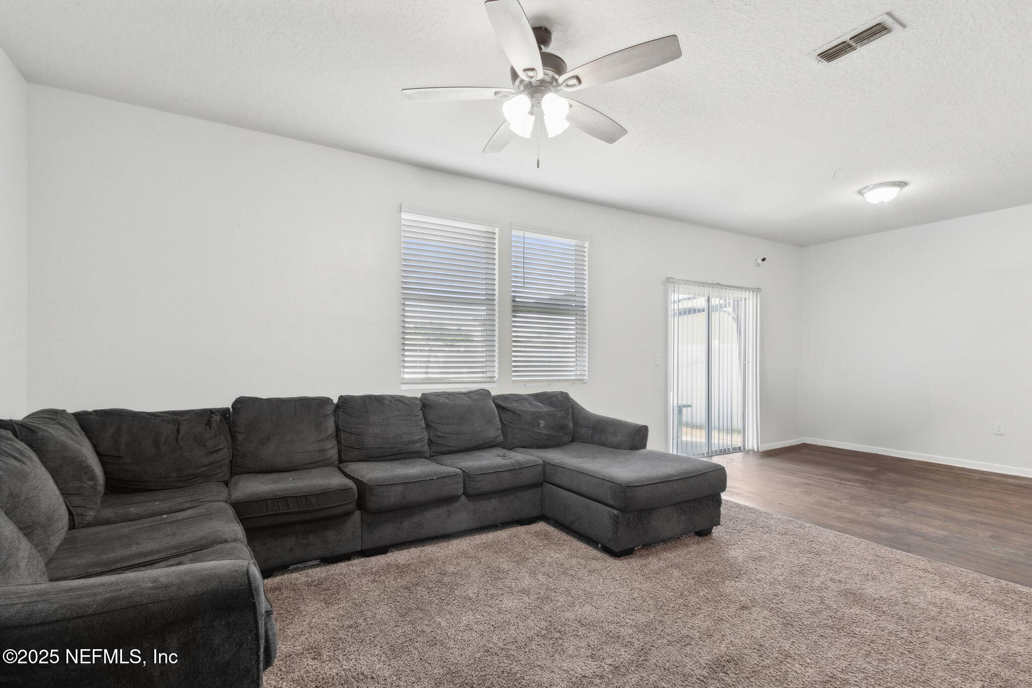 2487 Beachview Drive Jacksonville, FL 32218 - Photo 14 of 39 a living room with furniture and a window