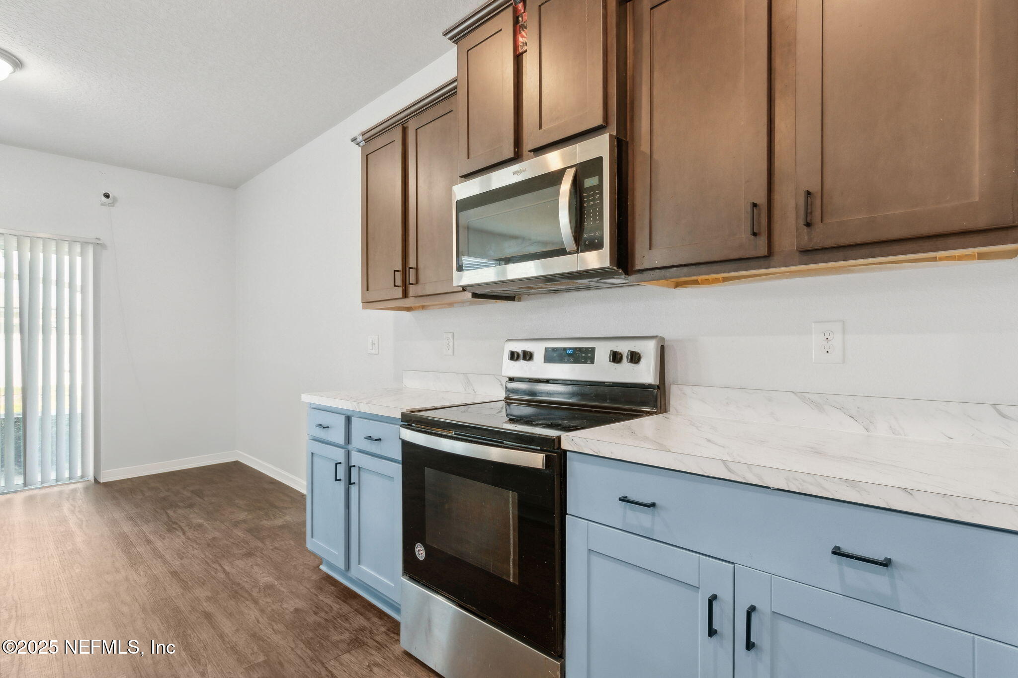 2487 Beachview Drive Jacksonville, FL 32218 - Photo 18 of 39 a kitchen with stainless steel appliances granite countertop a sink microwave and stove