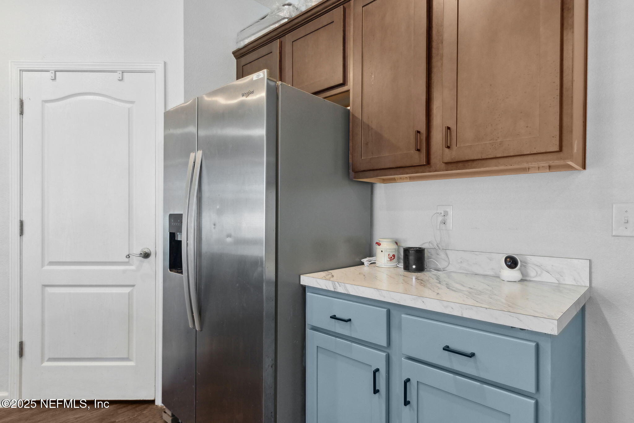 2487 Beachview Drive Jacksonville, FL 32218 - Photo 19 of 39 a kitchen with stainless steel appliances cabinets and a refrigerator