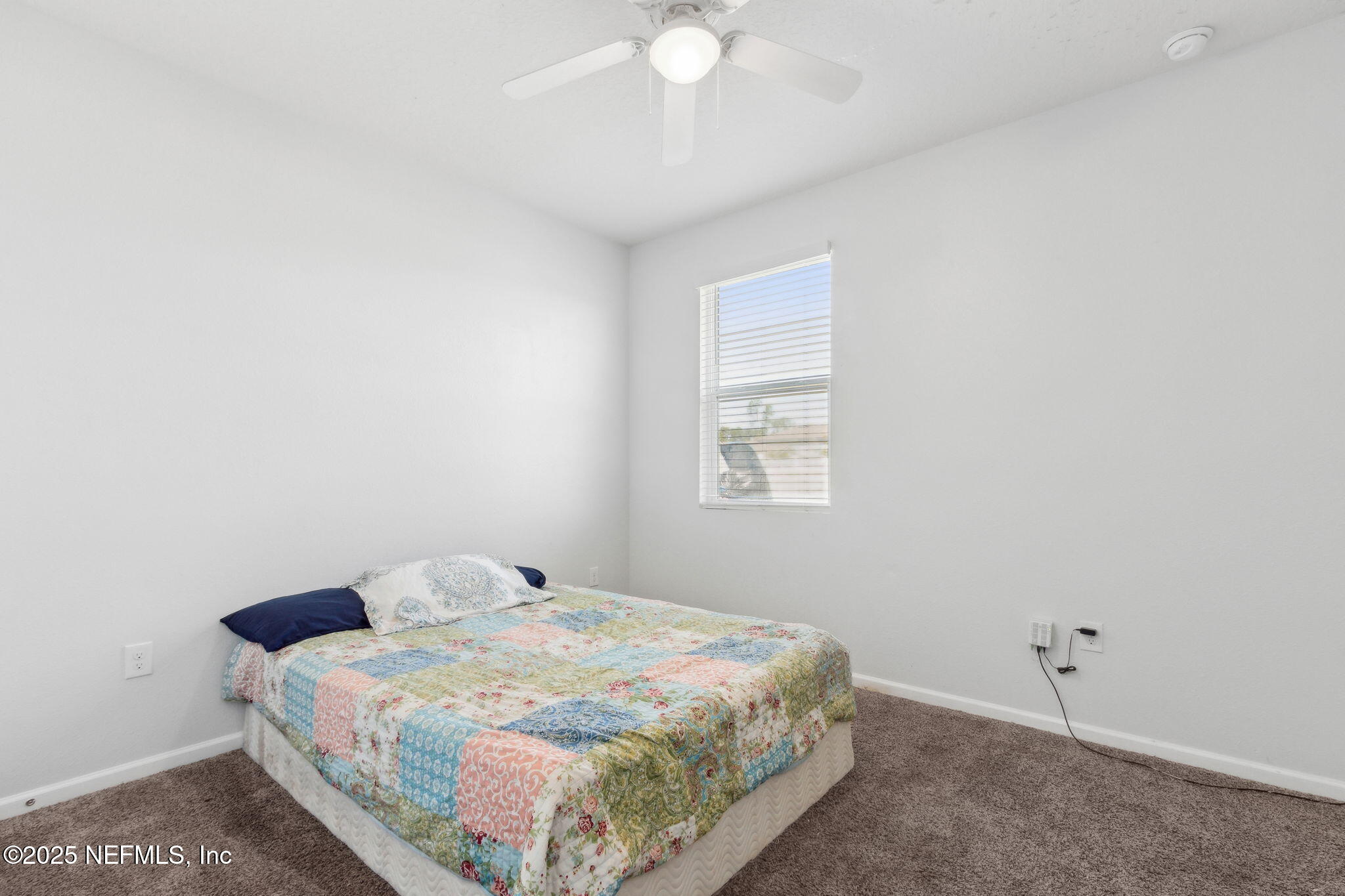2487 Beachview Drive Jacksonville, FL 32218 - Photo 20 of 39 a bedroom with a bed and a window