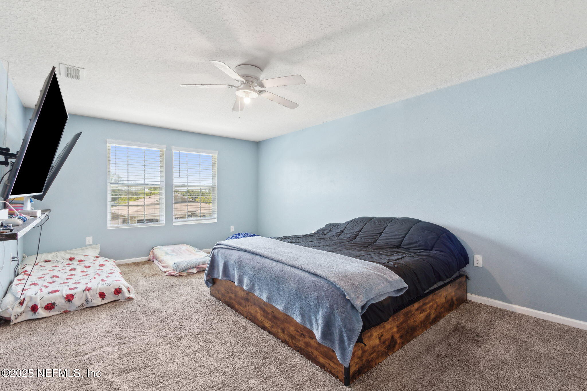 2487 Beachview Drive Jacksonville, FL 32218 - Photo 23 of 39 a bedroom with a bed and window