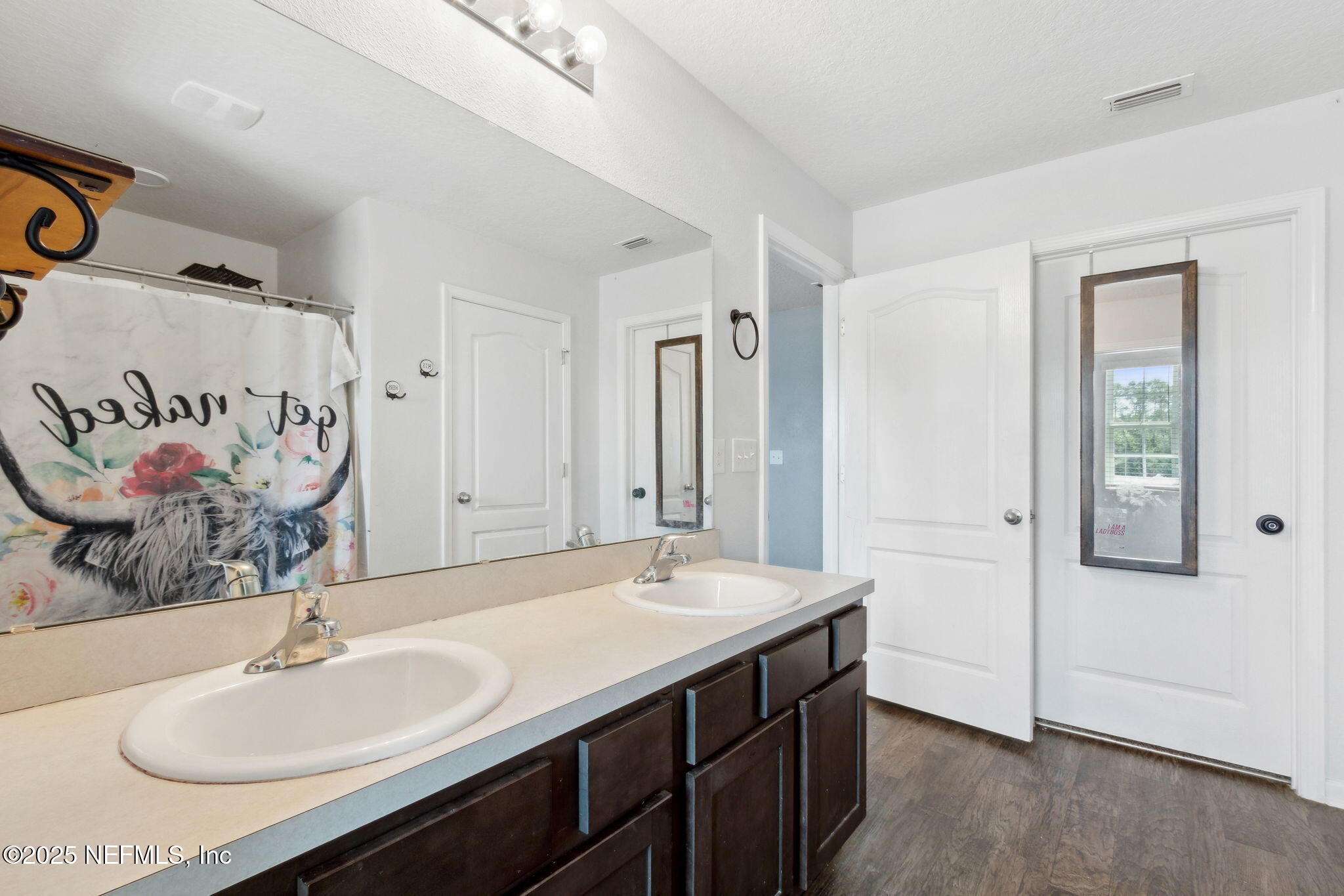 2487 Beachview Drive Jacksonville, FL 32218 - Photo 25 of 39 a bathroom with a sink and a mirror