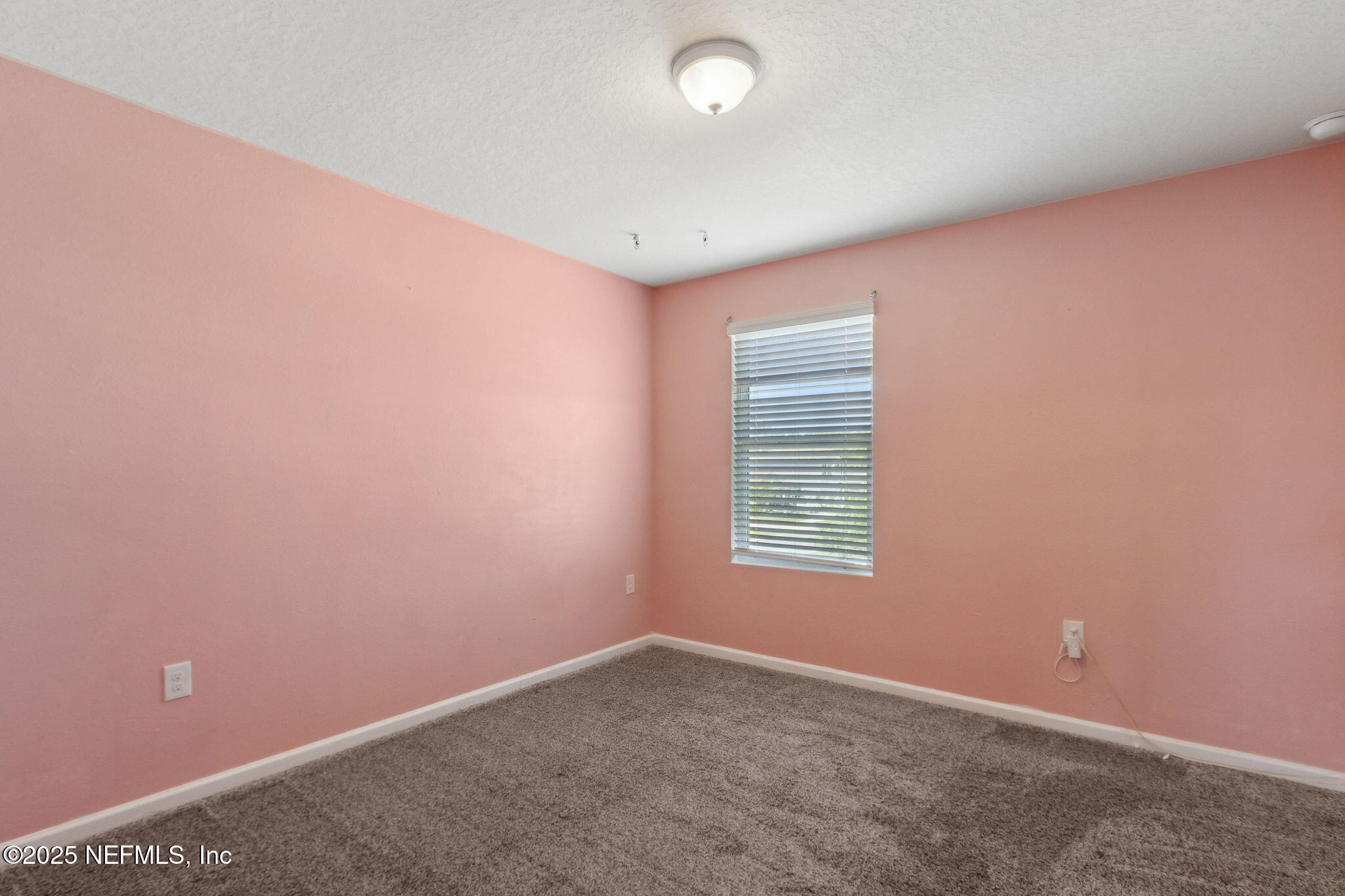 2487 Beachview Drive Jacksonville, FL 32218 - Photo 27 of 39 an empty room with a window