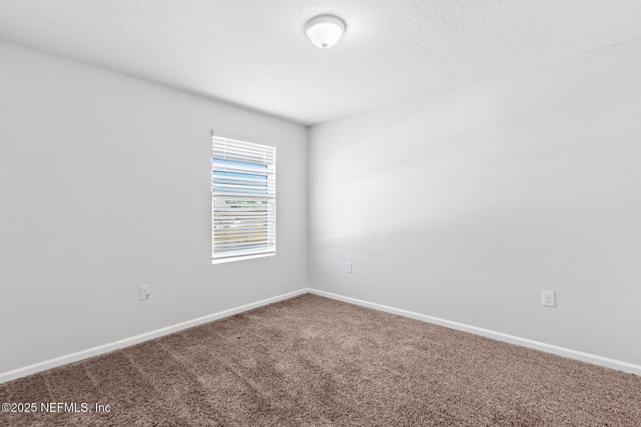 2487 Beachview Drive Jacksonville, FL 32218 - Photo 31 of 39 an empty room with windows