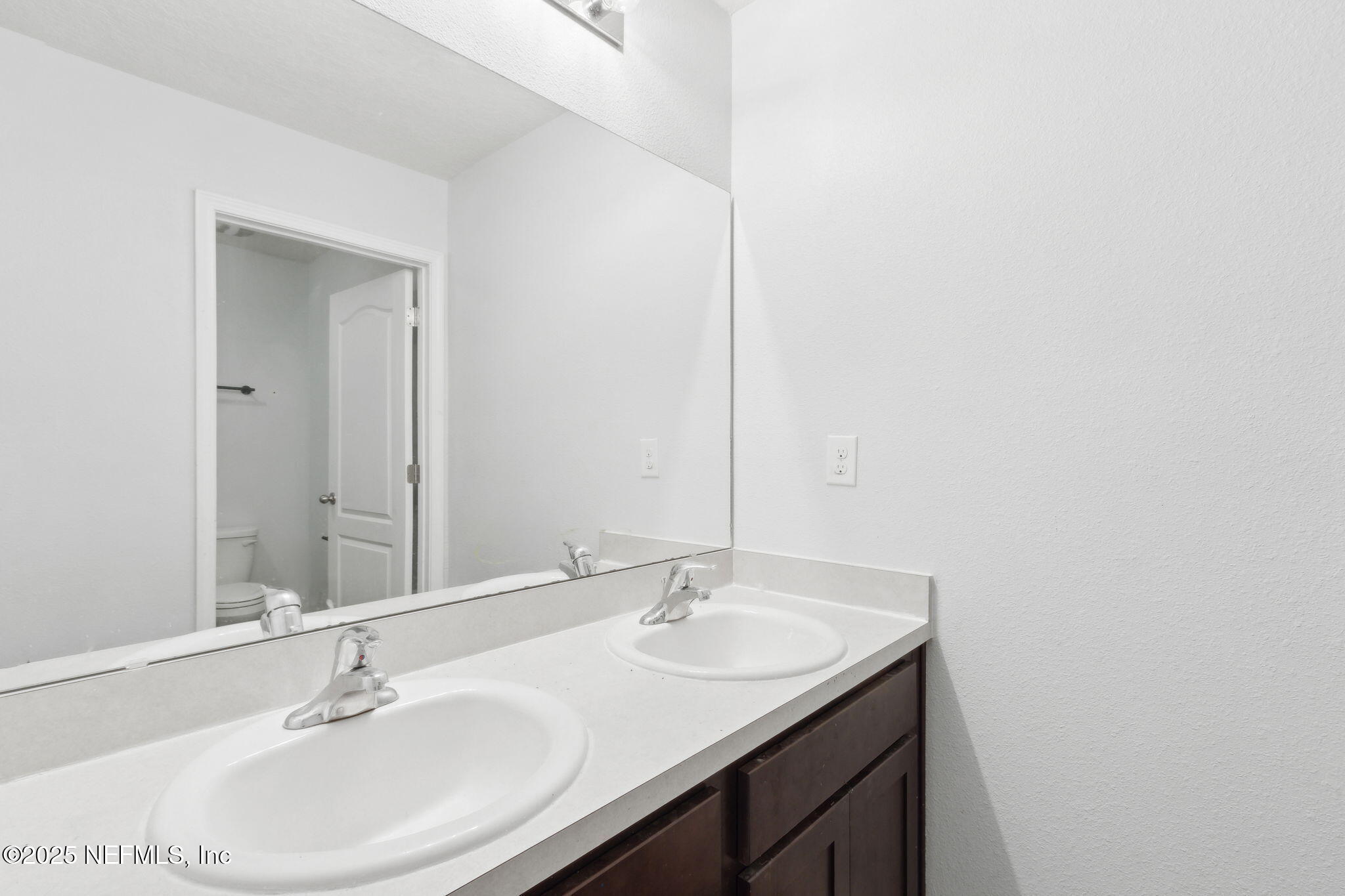 2487 Beachview Drive Jacksonville, FL 32218 - Photo 33 of 39 a bathroom with a sink and a mirror