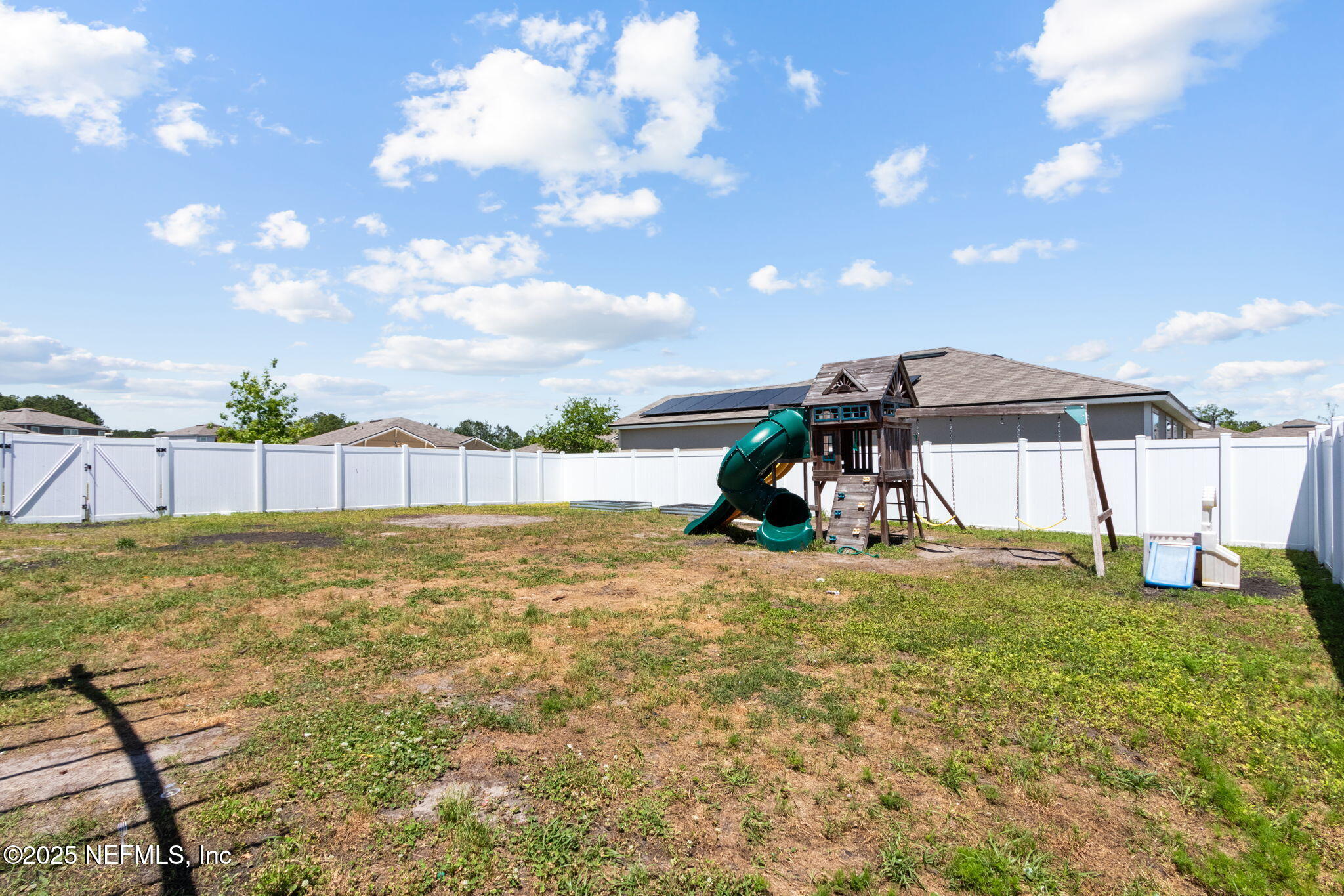 2487 Beachview Drive Jacksonville, FL 32218 - Photo 39 of 39 a view of a house with a yard and a garden