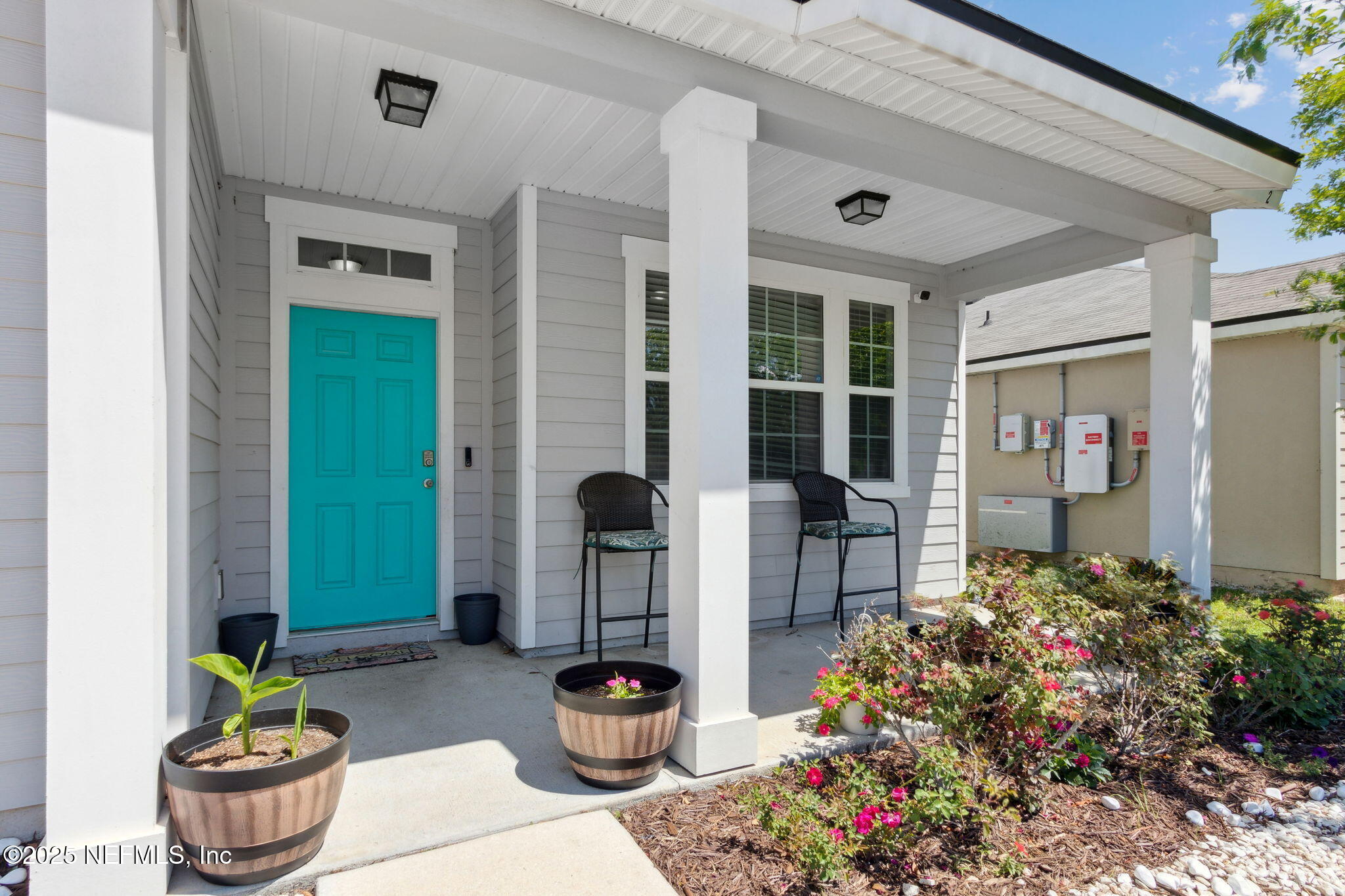 2487 Beachview Drive Jacksonville, FL 32218 - Photo 5 of 39 a front view of a house with outdoor seating and plants