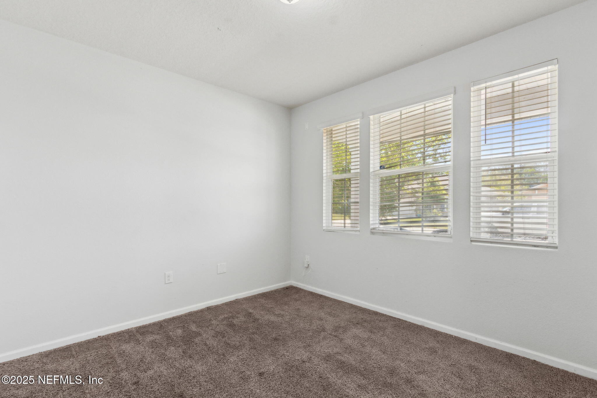 2487 Beachview Drive Jacksonville, FL 32218 - Photo 9 of 39 an empty room with a window
