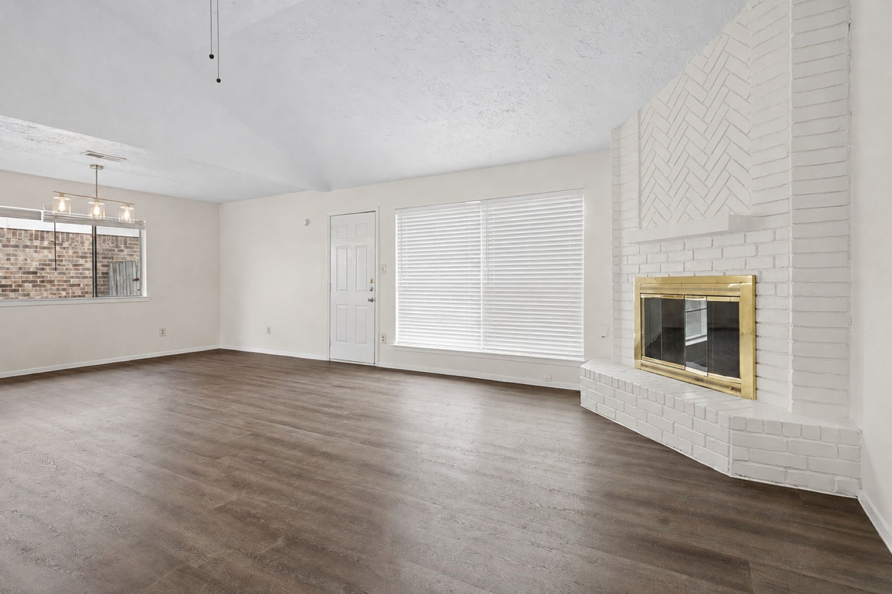 10411 Rabbit Oak Drive Houston, TX 77065 - Photo 4 of 21 Perfect for entertaining, this space features an open layout and a cozy wood-burning fireplace.