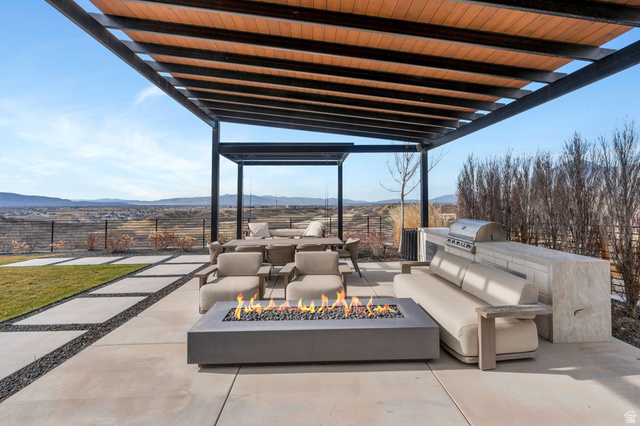 3918 South Mapleton Ests Drive Mapleton, UT 84664 - Photo 9 of 103 View of patio / terrace featuring a fire pit, a mountain view, an outdoor kitchen with living area, and a pergola