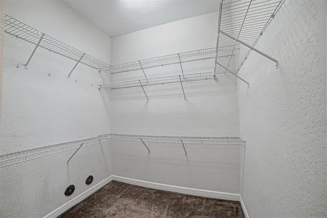 a view of a room with racks on the wall