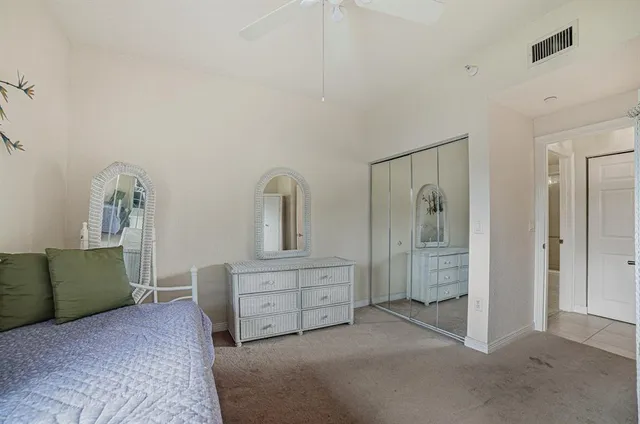 a room with a bed and a mirror