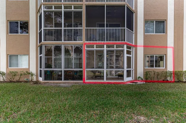 a view of building with yard in front of statue
