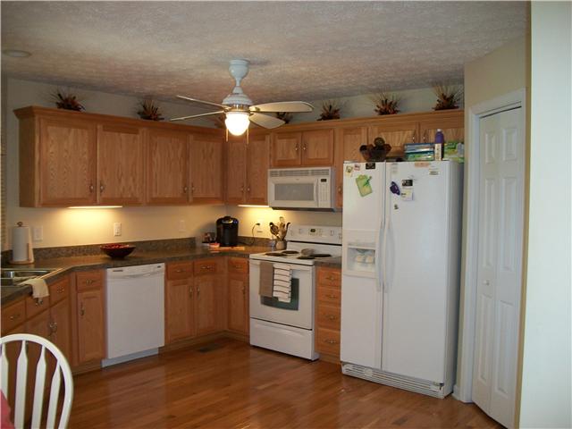 1005 Riverview Road Mount Juliet, TN 37122 - Photo 14 of 18 Kitchen has lots of cabinets and a pantry. Hardwood floors gleam and keep the look open.