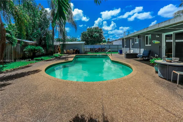a view of a swimming pool with a patio