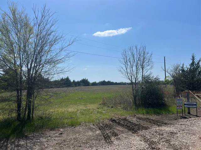 a view of a lake with a yard
