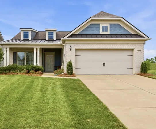 a front view of a house with yard