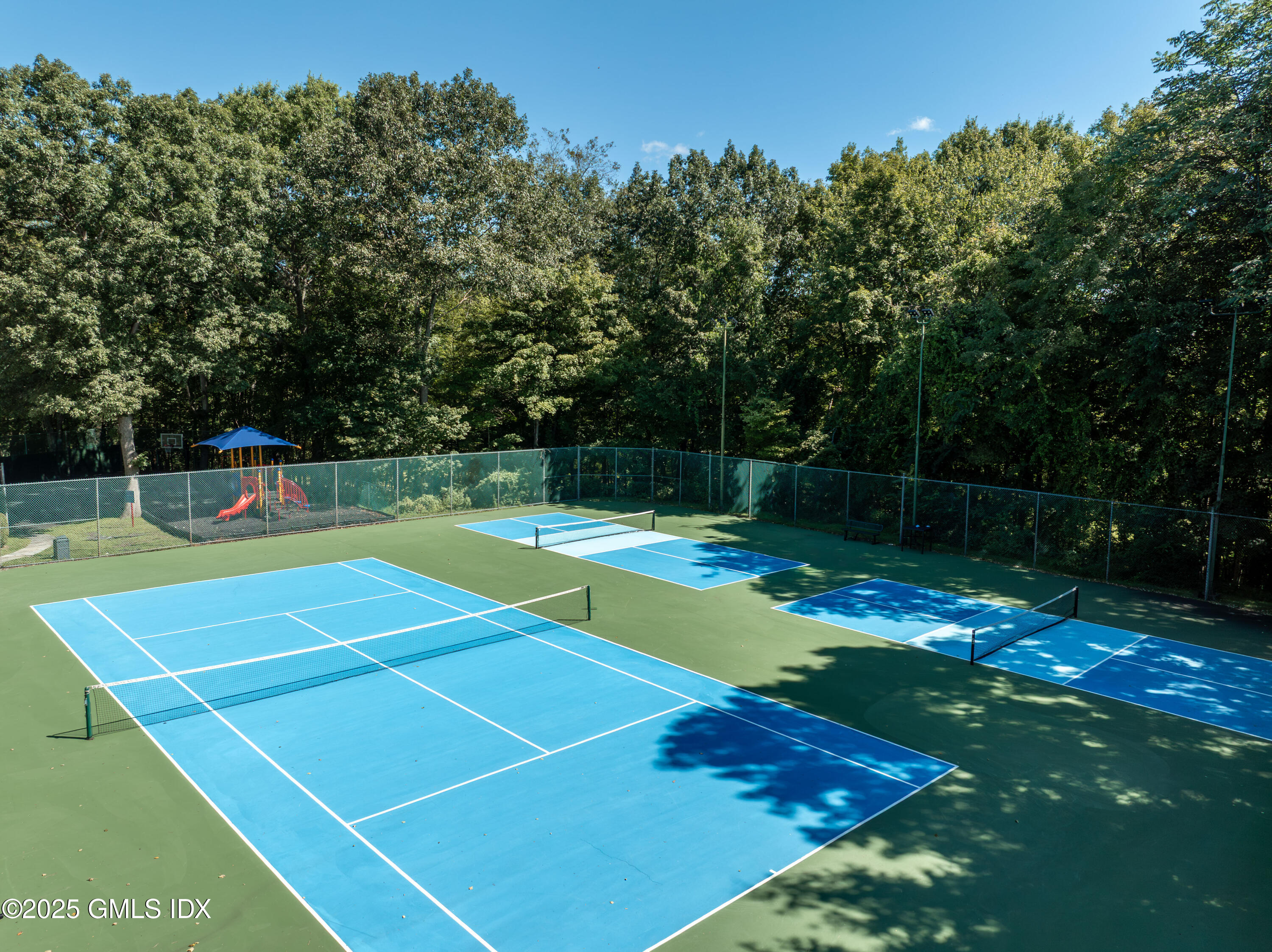 221 Weaver Street, Unit 19C Greenwich, CT 06831 - Photo 22 of 23 a view of a tennis court