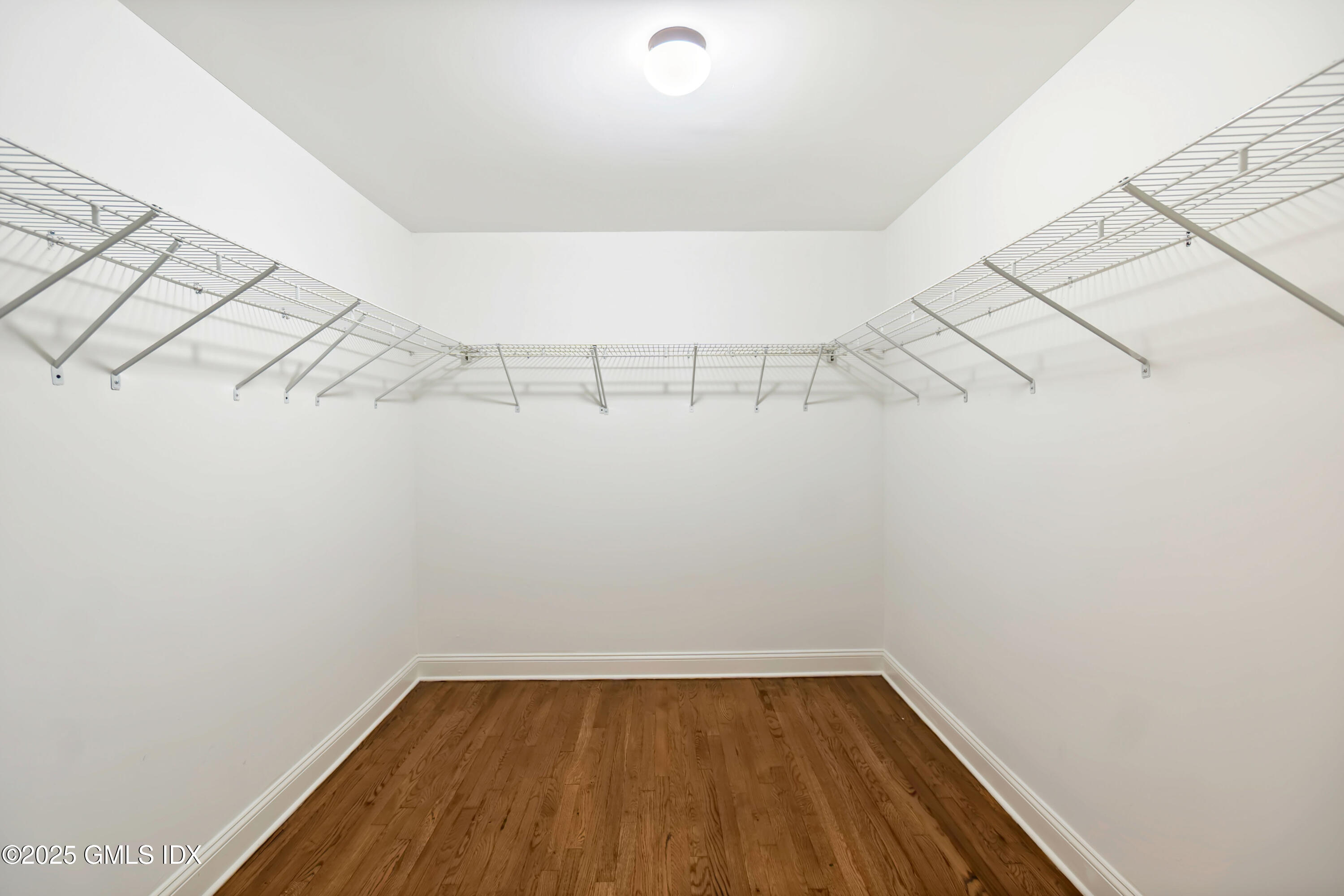 221 Weaver Street, Unit 19C Greenwich, CT 06831 - Photo 9 of 23 a view of a room with racks on the wall