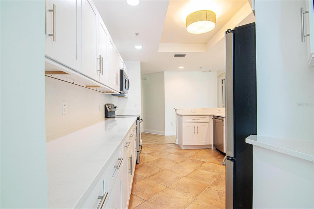 2743 First Street, Unit 406 Fort Myers, FL 33916 - Photo 12 of 52 a bathroom with a sink a vanity and a mirror