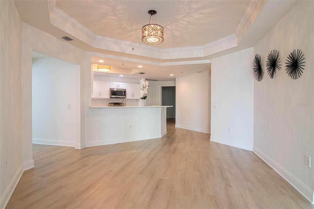 2743 First Street, Unit 406 Fort Myers, FL 33916 - Photo 25 of 52 a view of a kitchen cabinets and wooden floor