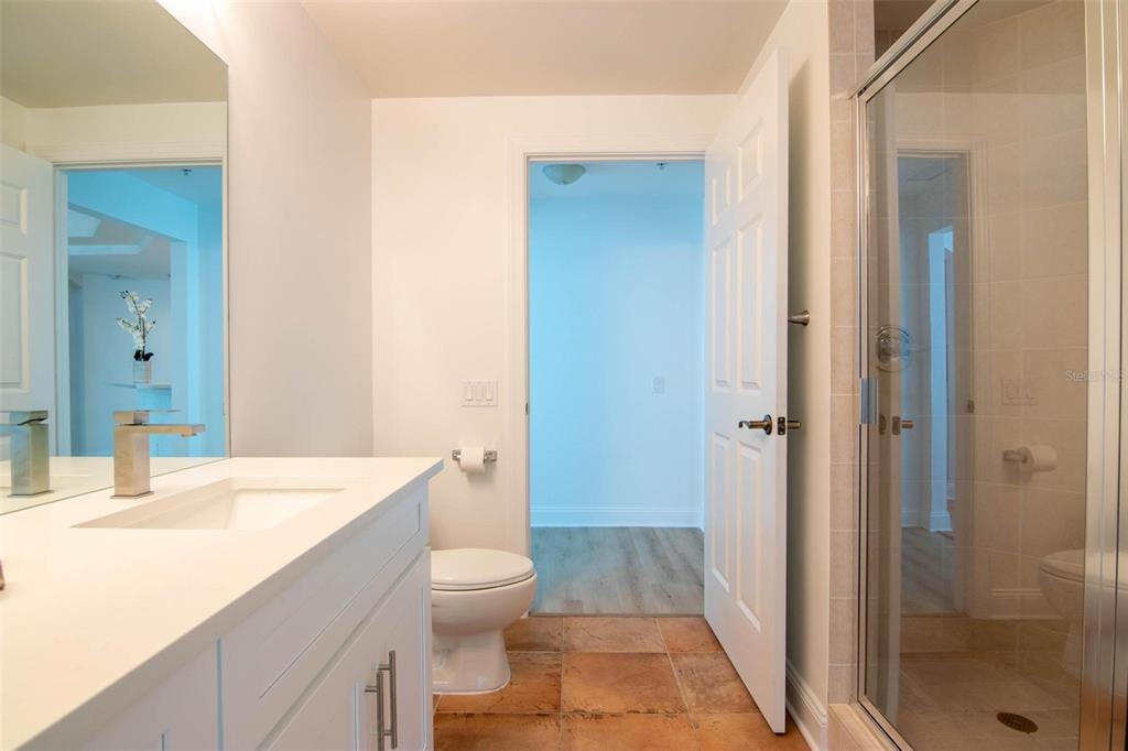 2743 First Street, Unit 406 Fort Myers, FL 33916 - Photo 35 of 52 a bathroom with a sink a toilet and shower