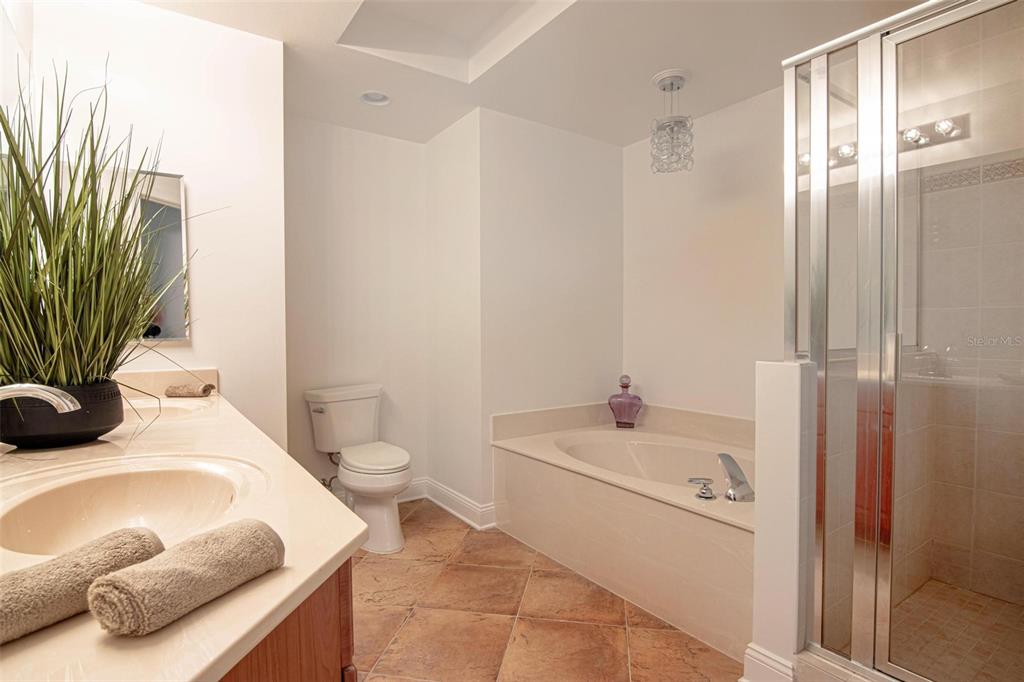 2743 First Street, Unit 406 Fort Myers, FL 33916 - Photo 45 of 52 a bathroom with a sink toilet and shower