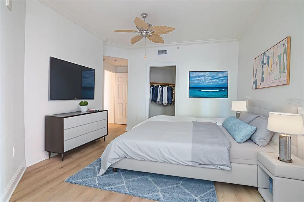 2743 First Street, Unit 406 Fort Myers, FL 33916 - Photo 48 of 52 a bedroom with a bed and a flat screen tv