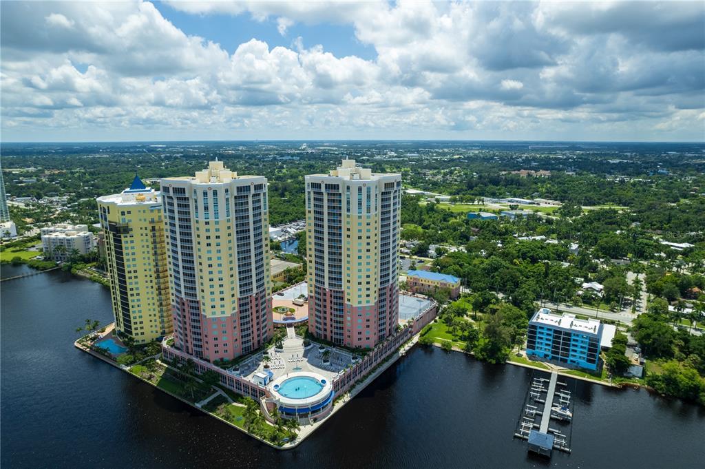 2743 First Street, Unit 406 Fort Myers, FL 33916 - Photo 8 of 52 a view of a lake with tall buildings