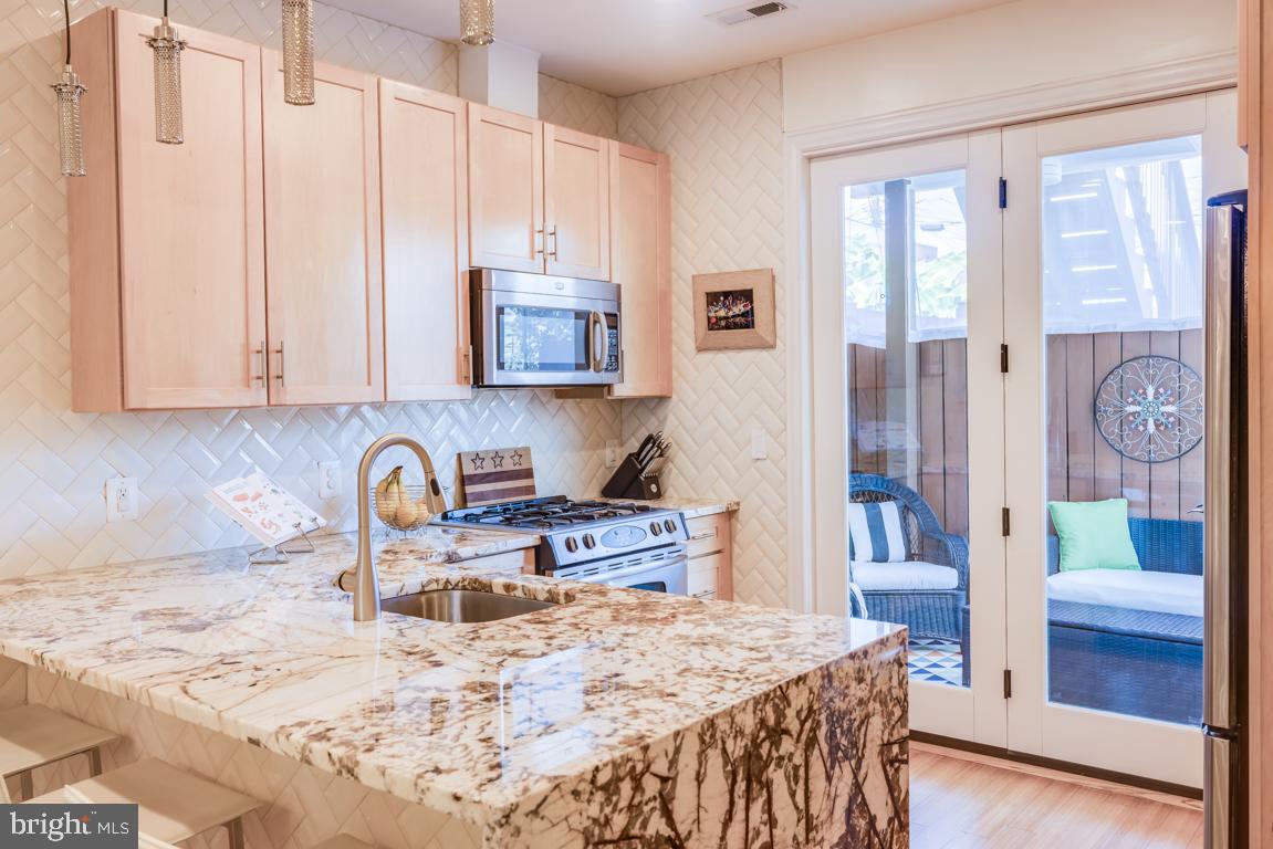 451 Ridge Street Northwest, Unit A Washington, DC 20001 - Photo 7 of 28 Updated Kitchen w/ Waterfall Counter