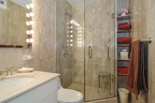 1310 North Ritchie Court, Unit 14C Chicago, IL 60610 - Photo 21 of 22 a bathroom with a sink toilet and shower