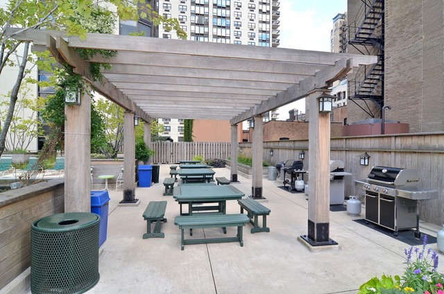 1310 North Ritchie Court, Unit 14C Chicago, IL 60610 - Photo 3 of 22 a building outdoor space with patio furniture