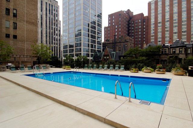 1310 North Ritchie Court, Unit 14C Chicago, IL 60610 - Photo 4 of 22 a view of swimming pool with outdoor seating and city view