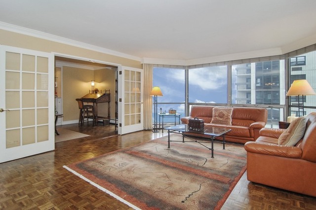 1310 North Ritchie Court, Unit 14C Chicago, IL 60610 - Photo 9 of 22 a living room with furniture and a table