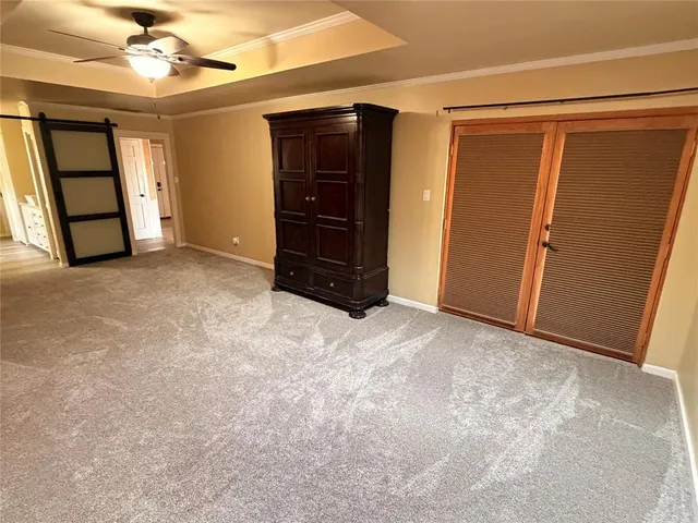 an empty room with closet and wooden roof