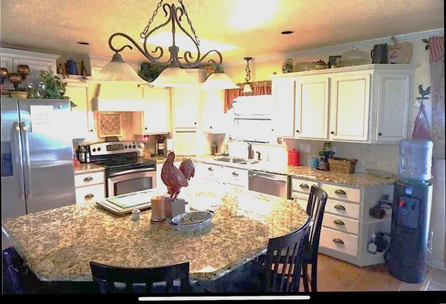 a bathroom with a sink vanity and a mirror