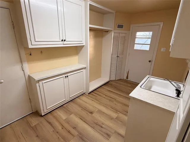 a bedroom with a bed and utility room