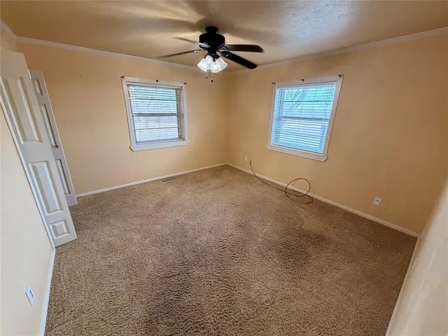 en view of an empty room with a window