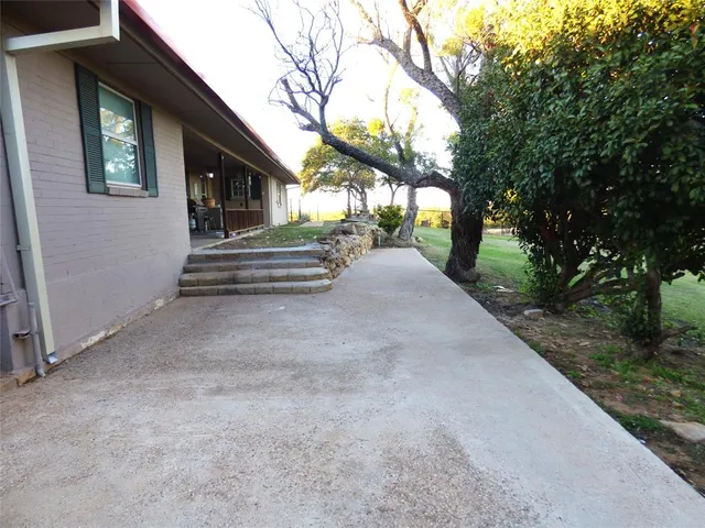 a view of a house with a tree