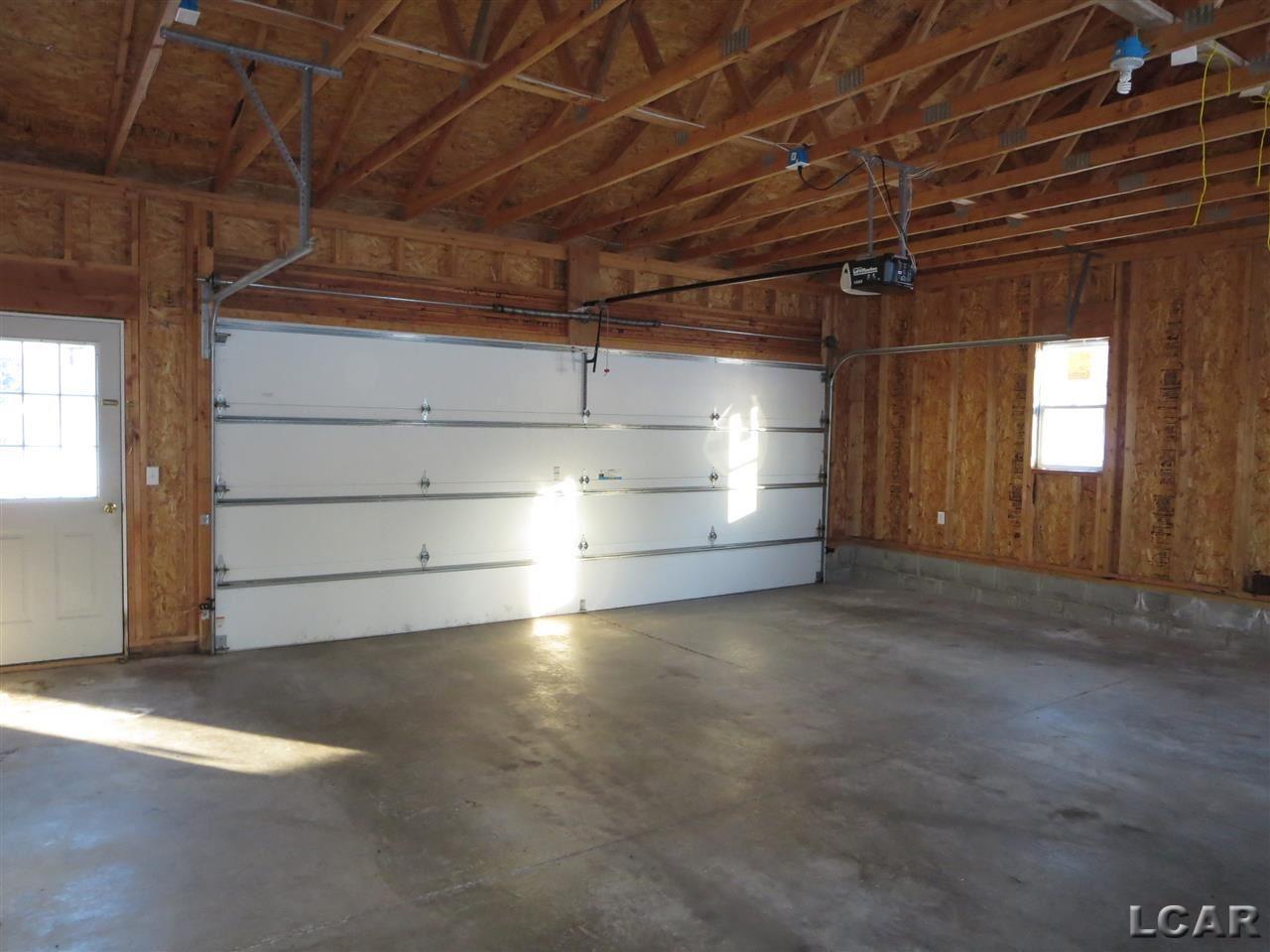 4521 Sutton Road Britton, MI 49229 - Photo 2 of 36 2 1/2 car attached garage