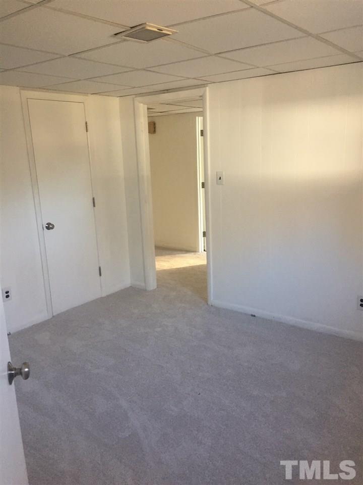 1318 Kent Road Raleigh, NC 27606 - Photo 27 of 28 lower level rear bedroom showing new carpeting
