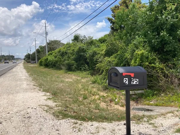 a sign that is on a pole on a street