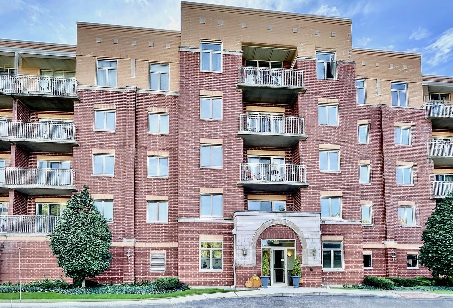 500 East St Charles Road, Unit 201 Lombard, IL 60148 - Photo 1 of 41 a front view of a multi story residential apartment building