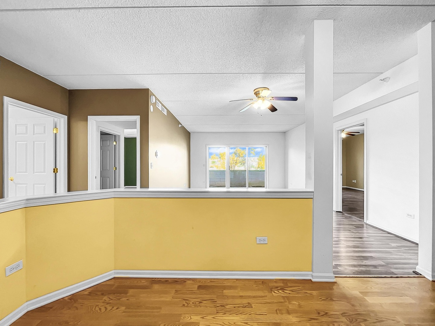500 East St Charles Road, Unit 201 Lombard, IL 60148 - Photo 11 of 41 a view of an empty room with window and wooden floor