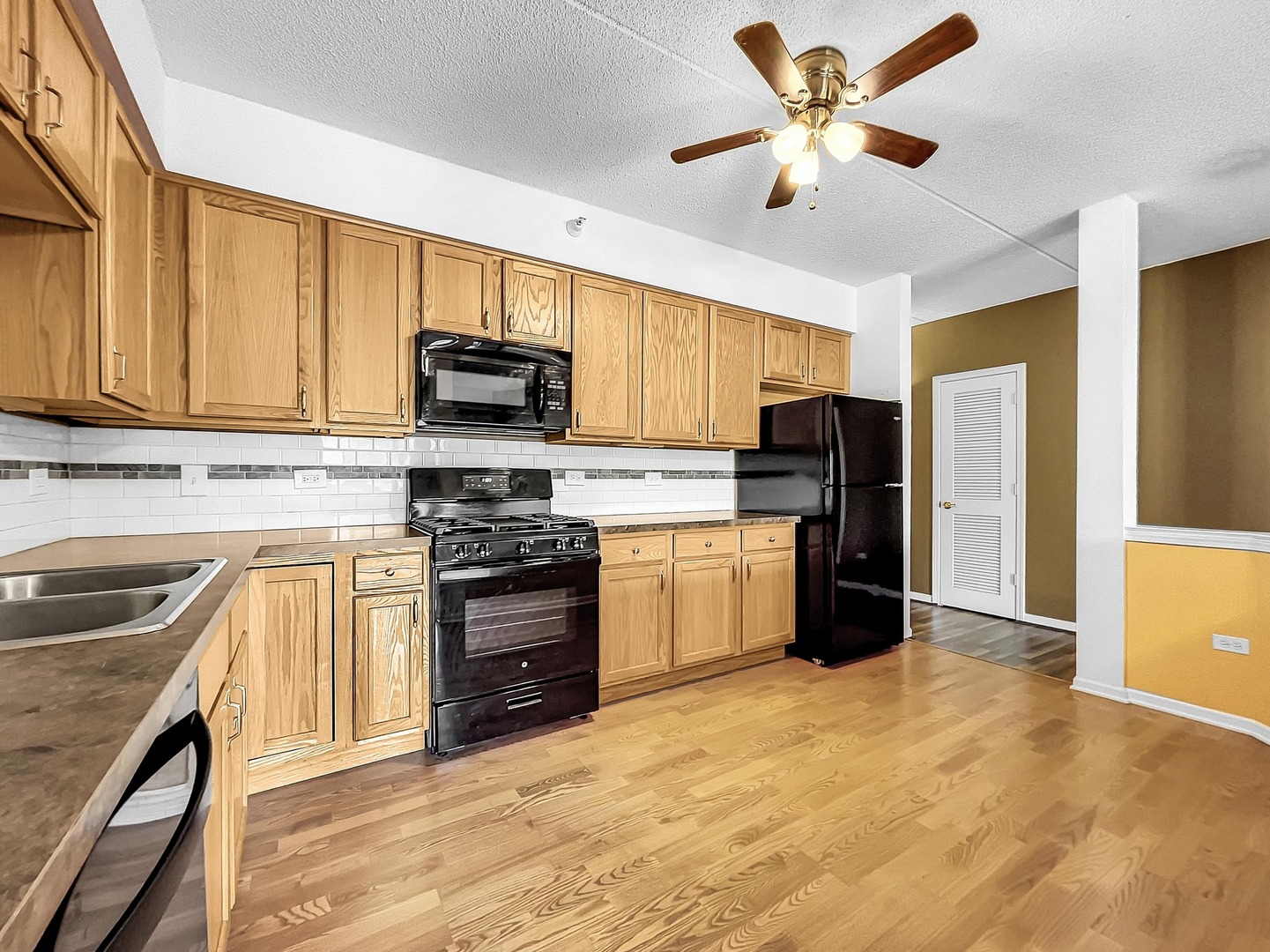 500 East St Charles Road, Unit 201 Lombard, IL 60148 - Photo 13 of 41 a kitchen with granite countertop a refrigerator stove top oven and sink