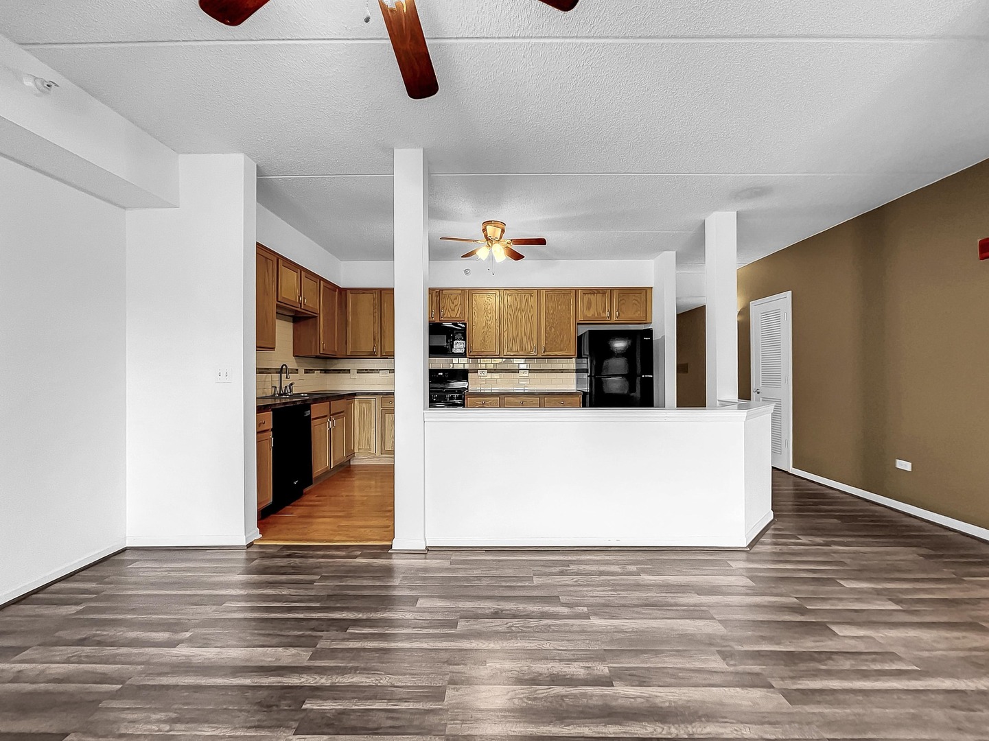 500 East St Charles Road, Unit 201 Lombard, IL 60148 - Photo 16 of 41 a view of kitchen with cabinets and wooden floor