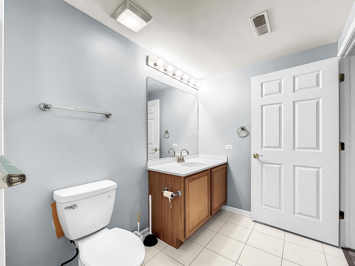 500 East St Charles Road, Unit 201 Lombard, IL 60148 - Photo 26 of 41 a bathroom with a toilet sink and mirror