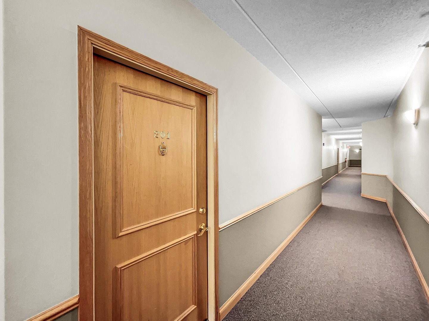 500 East St Charles Road, Unit 201 Lombard, IL 60148 - Photo 34 of 41 a view of a hallway with wooden floor