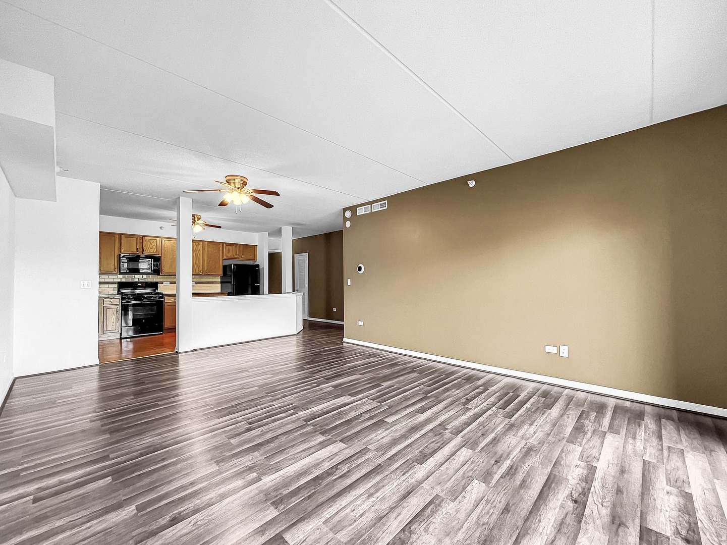500 East St Charles Road, Unit 201 Lombard, IL 60148 - Photo 7 of 41 a view of a livingroom with wooden floor