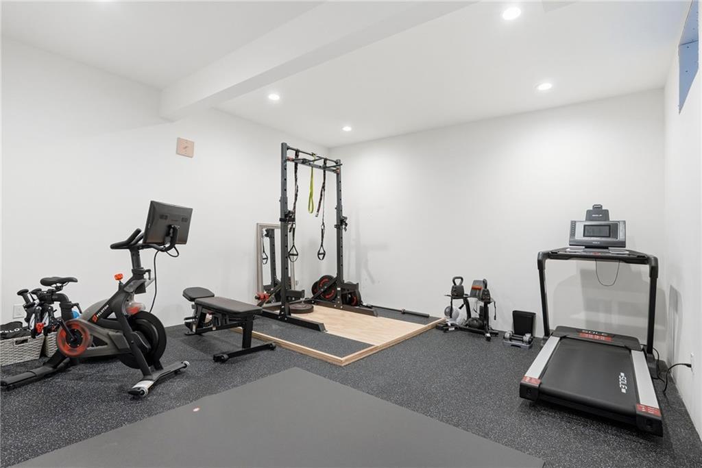 225 Stoup Road Mars, PA 16046 - Photo 42 of 50 The lower level gym features rubber flooring and recessed lighting — a dedicated fitness space ready to use without ever leaving home.